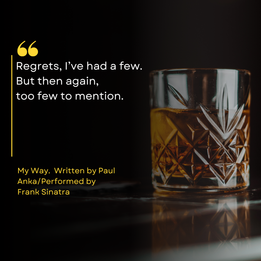 The text reads "Regrets, I've had a few, but then again, too few to mention. My Way written by Paul Anka, performed by Frank Sinatra." There is a glass of whiskey in the background