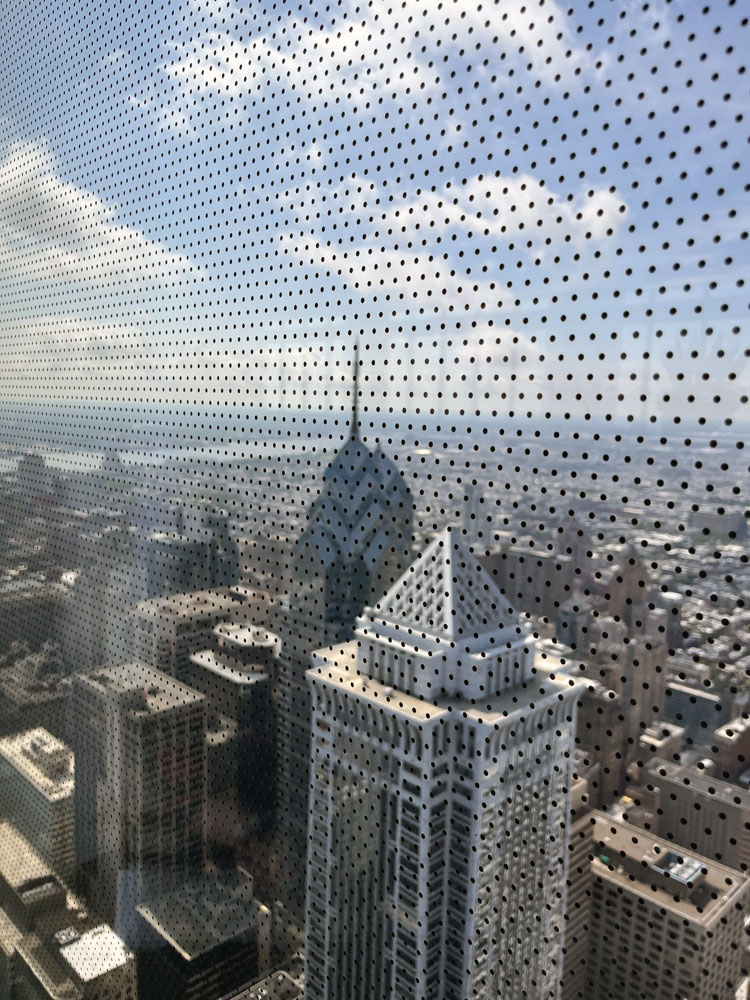 a photo from the glass window of the Four Seasons elevator. Pictured is Liberty Tower, which used to be the highest building in the city. This point of view