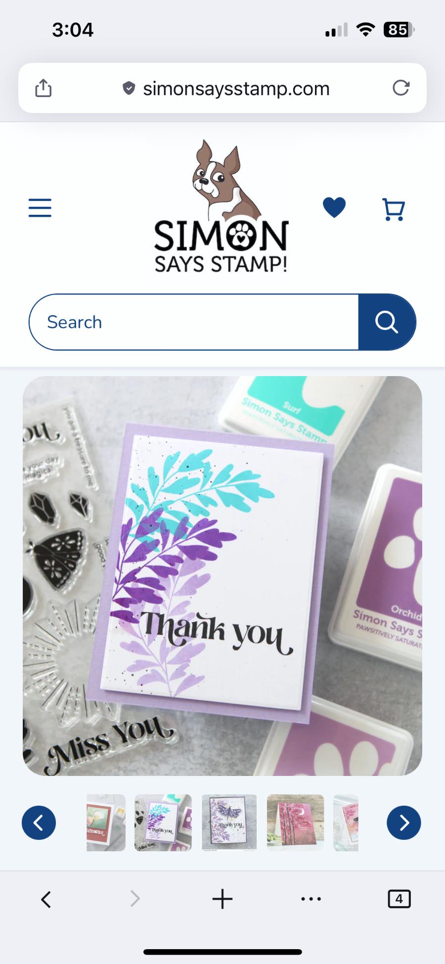 leaf fronds stamped in turquoise blue and two shades of purple with a 'thank you' greeting. it's on a lavender background