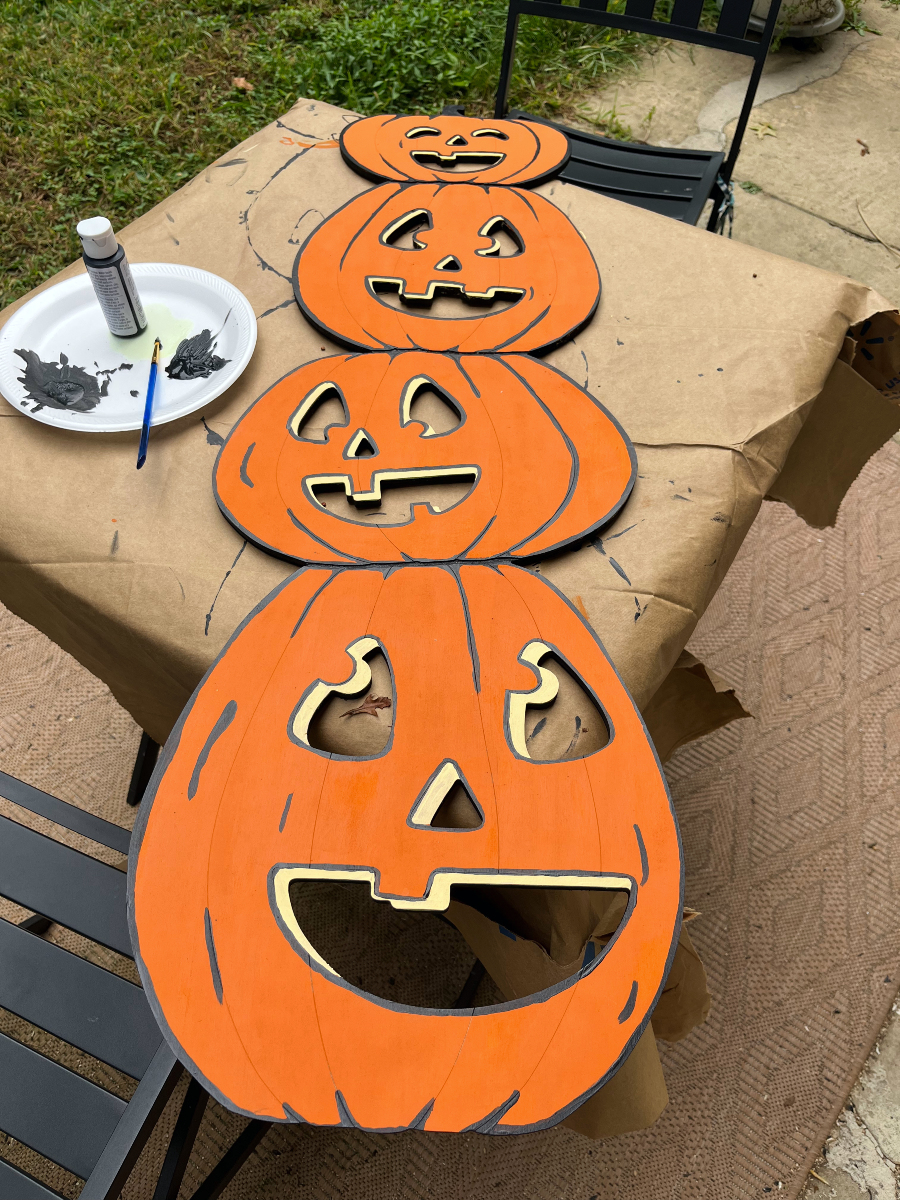 the pumpkins, but now with black outlining around the features