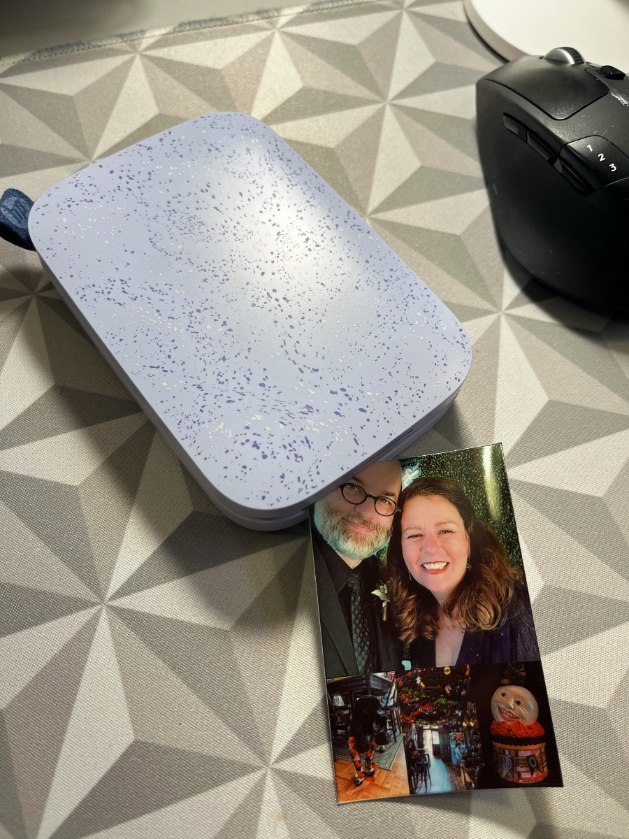 a small HP Sprocket printer and the photo collage it printed