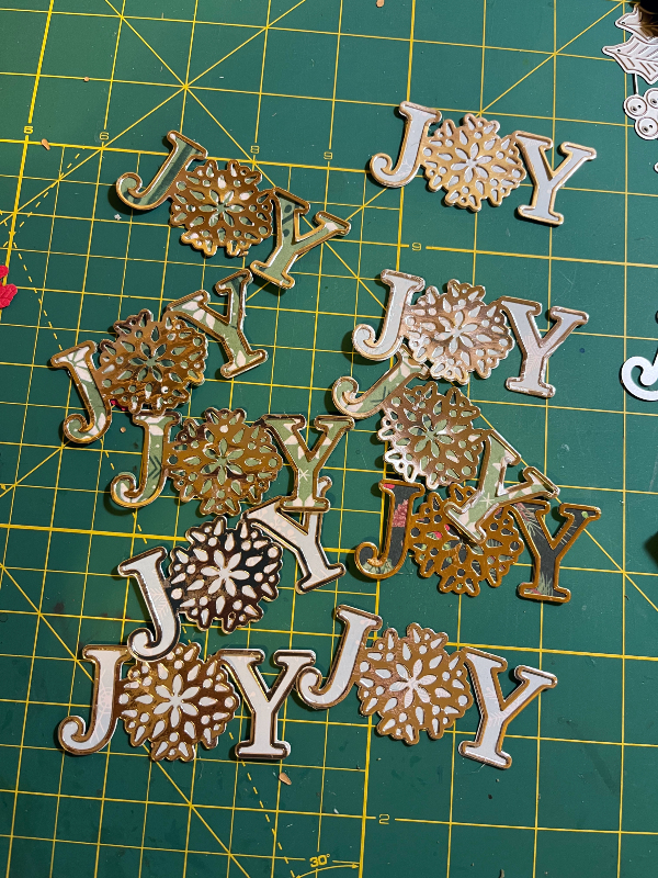 an assortment of cut out JOY