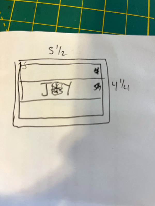a sketch of a horizontal card with three stripes and JOY in the middle