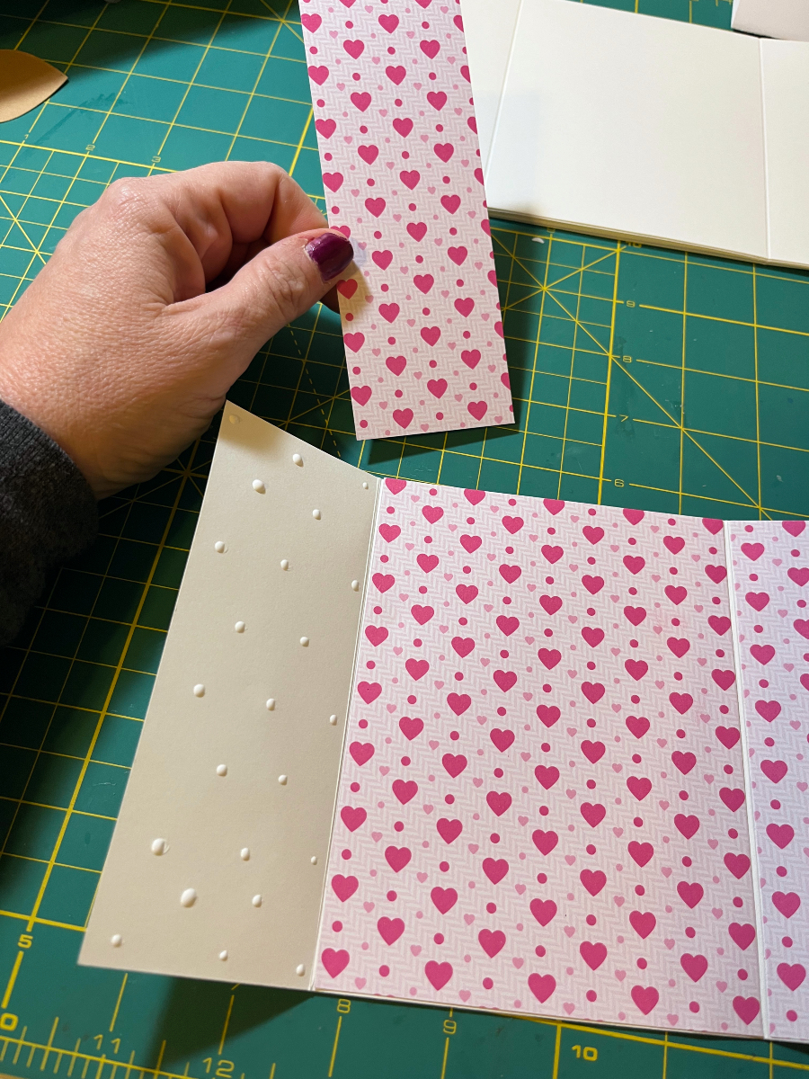 gluing paper to the inside of a card panel, there are almost two dozen dots of glue