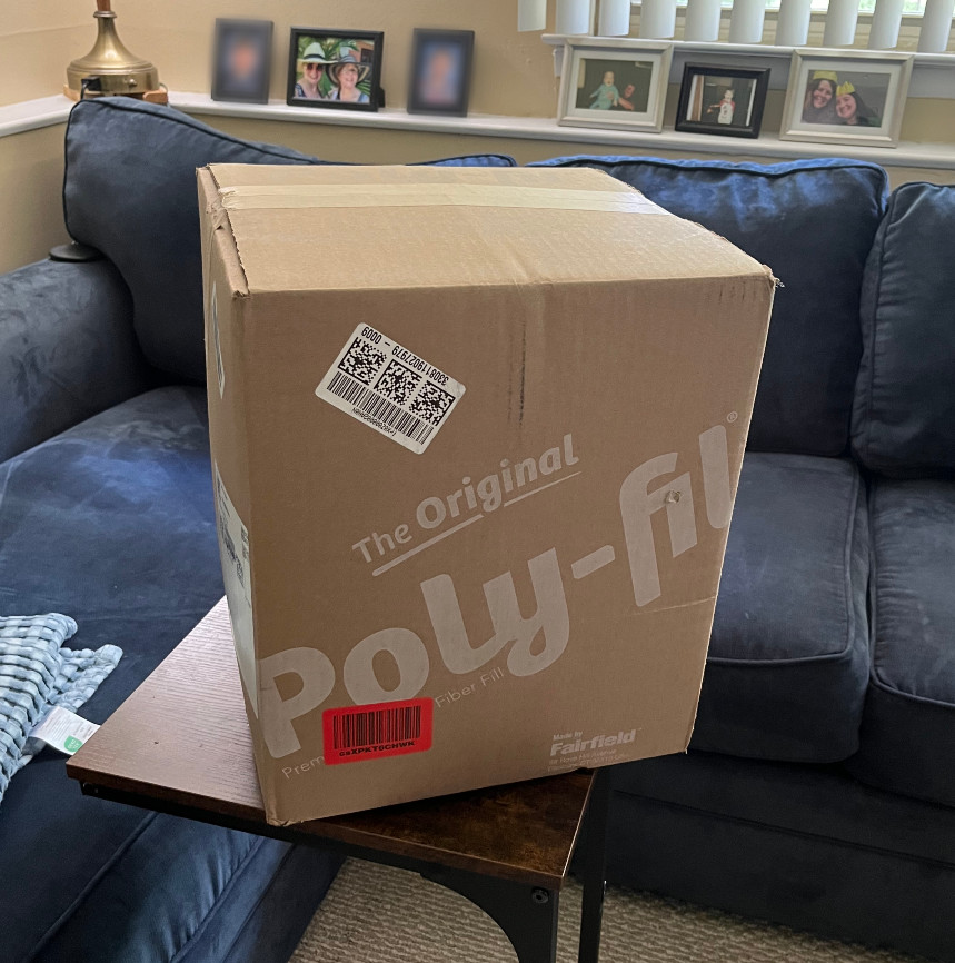 a large cardboard box with "The Original Poly-fil" on it