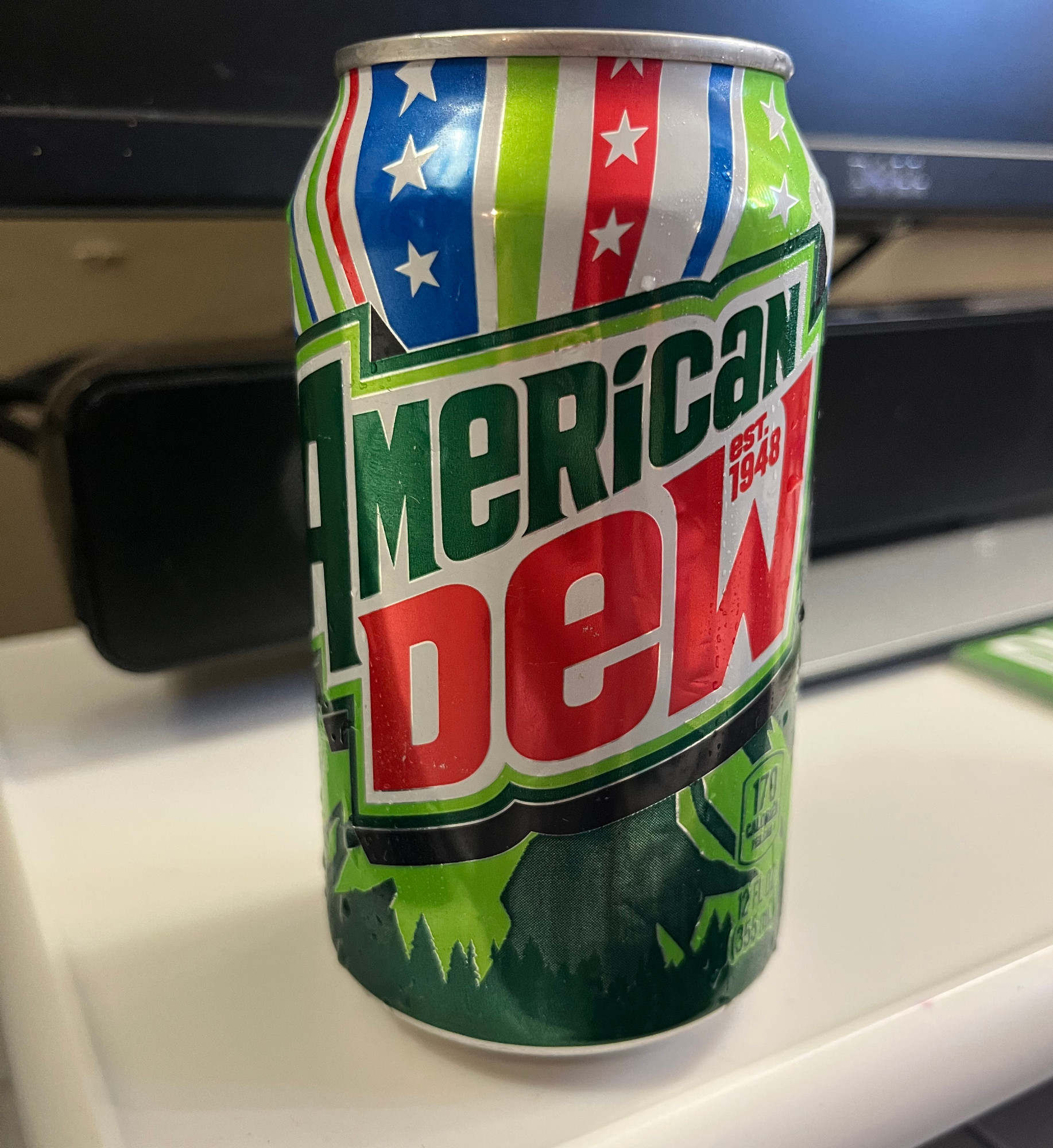 a can of mountain dew, garishly decorated for America's 250th, and named American Dew