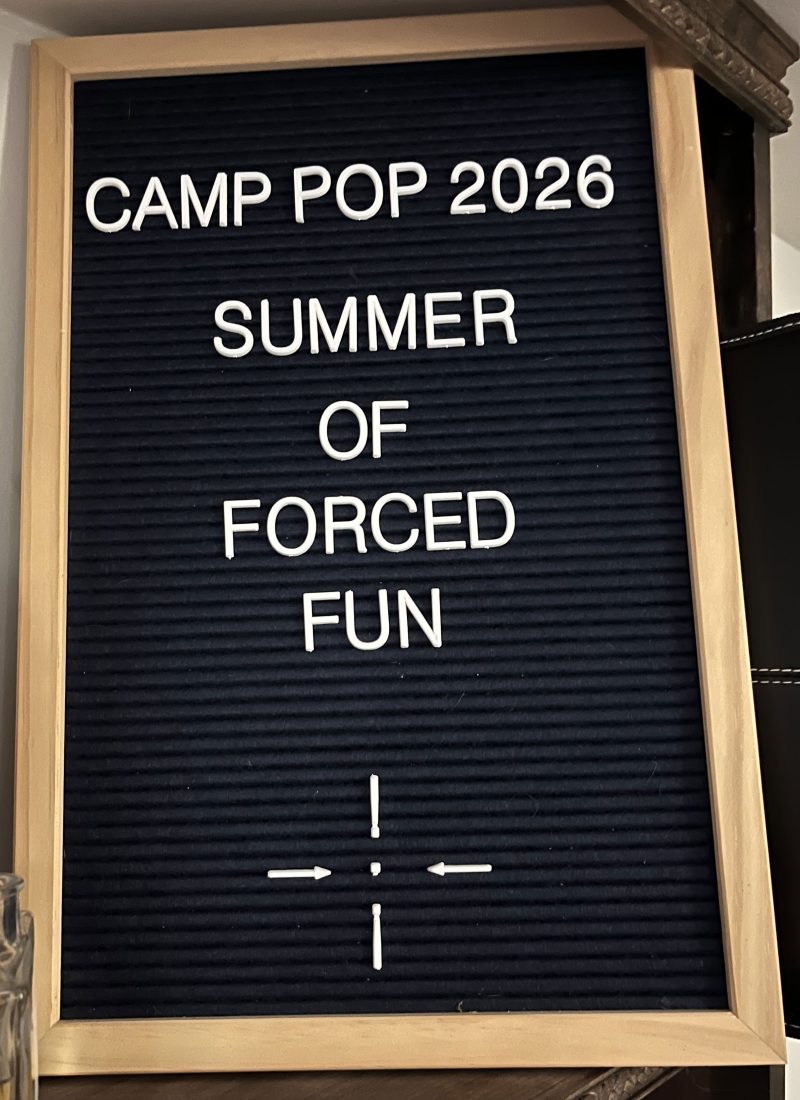 letterboard with "CAMP POP 2026 Summer of Forced Fun"